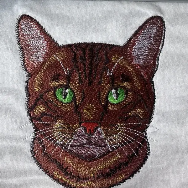 Cat portrait embroidered in fine detail