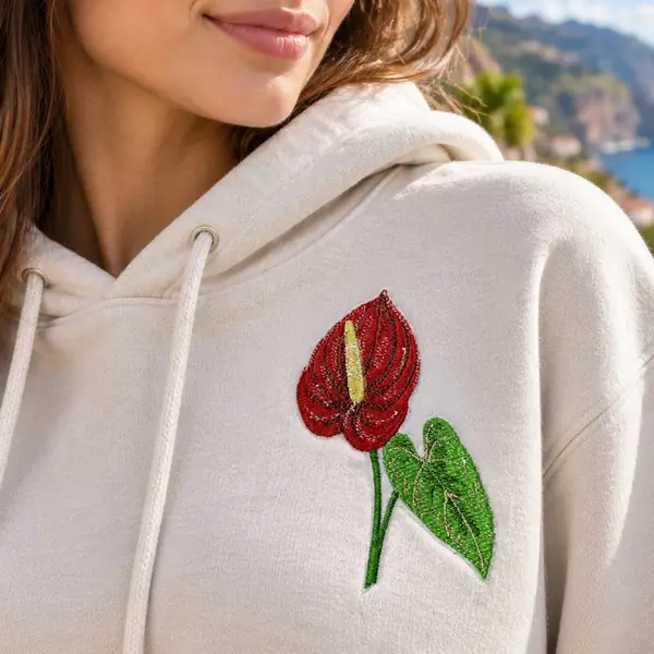 Cream hoodie embroidered with a red anthurium
