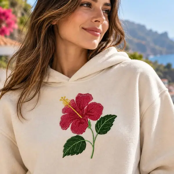 Cream hoodie embroidered with a red hibiscus